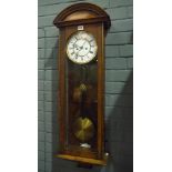 A 19th Century walnut cased regulator wall clock with circular white dial enclosed by a plain