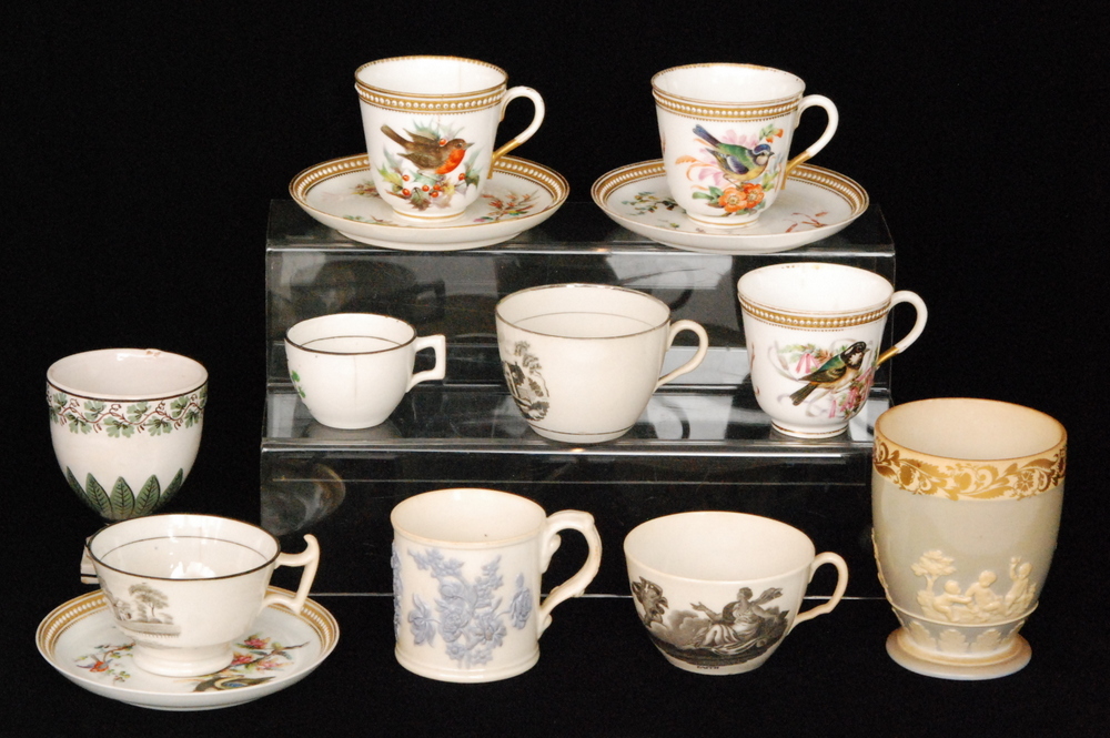 A collection of assorted 19th Century tea wares to include a tea cup decorated with a black and