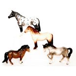 Four Beswick horse comprising a Stocky Jogging Mare model 1090, Shetland Pony model 1033,