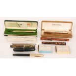 A Conway Stewart purple cased marble effect fountain pen, two other similar pens,