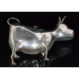 A 19th Century Dutch silver cow creamer modelled in a standing position,