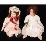 An Armand Marseille bisque head doll with open close eyes and jointed composition body wearing a