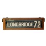 An early 20th Century Longbridge 72 destination tram board housed in an oak glazed case,