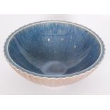 A large Norman Wilson for Wedgwood footed bowl of flared form with ribbed fluting to the exterior,