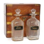 A 19th Century brass mounted decanter box with two later associated mitre cut decanters, S/D,