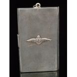 A hallmarked silver triple fold rectangular card case with engine turned decoration and applied RAF