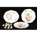 Nine Coalport menu or name card holders each modelled as a flower head with hand painted decoration