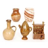 A studio pottery model of a Welsh Dresser with plates, mugs and jugs decorated in a brown glaze,