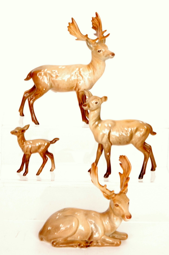 A Beswick Deer family comprising a Lying Stag model 954, a Standing Stag model 981,