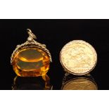 A George V sovereign ring dated 1913 in a 9ct pierced mount, ring size M,