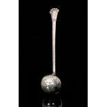 An Art and Crafts Danish silver tea infuser with elongated planished tapering handle terminating in