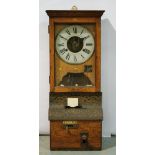 An early 20th Century oak cased National Time Recorder Company Ltd clocking in clock with embossed