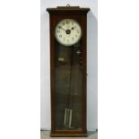An early 20th Century oak cased National electric rewind impulse clock with circular dial