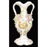 A late 19th Century Coalport style twin handled vase decorated with two landscape roundels