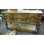 A 16th Century style carved oak sideboard,