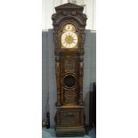 A late 19th Century carved oak longcase clock of large proportions with eight day three train
