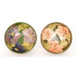Two Moorcroft Pottery footed bowls, the first decorated in the Coral Hibiscus pattern diameter 15cm,