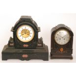 A Victorian black slate mantle clock with anchor escapement and circular dial and columns in agate