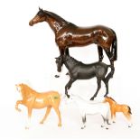 Four Beswick horse comprising Black Beauty model 2466,
