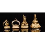 Four 19th Century gilt metal seal fobs each with a stone set matrix of plain form,