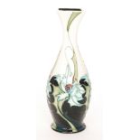 A Moorcroft Pottery vase of footed form leading to a square collar neck decorated in the Sea Holly