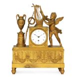 A 19th Century French gilt mantle clock with eight day movement within a classical case with winged