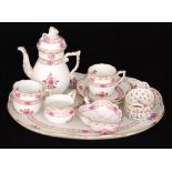 A Herend cabaret set comprising coffee pot, two coffee cans and saucers,