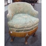 A 1930s walnut bedroom chair, with silvered scroll capitals to the scalloped apron.