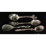 Two Dutch silver spoons, one with windmill embossed bowl below a cast galleon ship terminal,