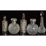 Two Victorian hallmarked silver topped scent bottles,