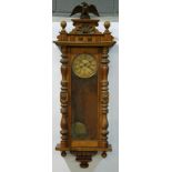 A late 19th to early 20th Century walnut Vienna style wall clock, spring driven movement,