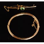 A 9ct bar brooch mounted with cushion cut green quartz, stamped,