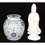 A Chinese blue and white jar and cover decorated with large stylised flowers and foliage,