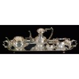 A 1970s hallmarked silver miniature tea service composed of teapot, hot water,