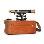 A 1920s or later surveyor's level by E Watts cased together with a tripod and adjustable rule.
