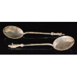 A pair of Victorian hallmarked silver apostle spoons with circular bowls below plain stems and