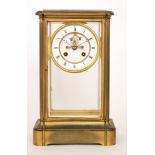 A late 19th Century brass cased and glazed mantle clock with eight day striking movement by LeRoy &