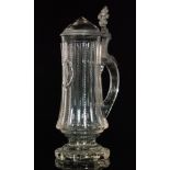 A late 19th Century crystal glass beer stein of footed form with a pillar cut body between notch