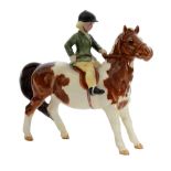A Beswick Girl on Pony, skewbald horse, model 1499,
