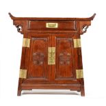 A 20th Century Chinese hardwood cabinet, fitted with a single drawer over a two door base,