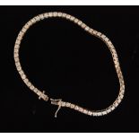 A 9ct hallmarked white gold diamond tennis bracelet,