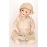 An early 20th Century Armand Marseille bisque head doll with open mouth showing teeth,