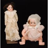 A Heubach and Kopplesdorf bisque head doll marked 320.