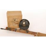 An early 20th Century 3 3/4 inch alloy salmon reel with brass foot,