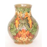 A Moorcroft Pottery vase decorated in the Flame of the Forest pattern designed by Phillip Gibson,