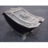 A late 19th Century steel coal scuttle in the Aesthetic taste,