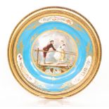 A late 19th Century Sevres framed hand painted charger decorated to the central roundel with a