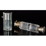 A Victorian hallmarked silver topped scent bottle with cylindrical base and hinged silver cap,