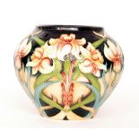 A Moorcroft Pottery ovoid vase decorated in the Royal Gold pattern designed by Rachel Bishop,