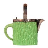 A late 19th Century Coalport teapot with moulded bark effect glazed in green,